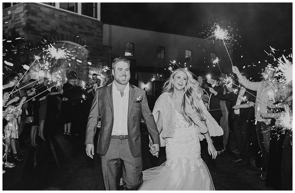 black and white photo of bride and groom sendoff
